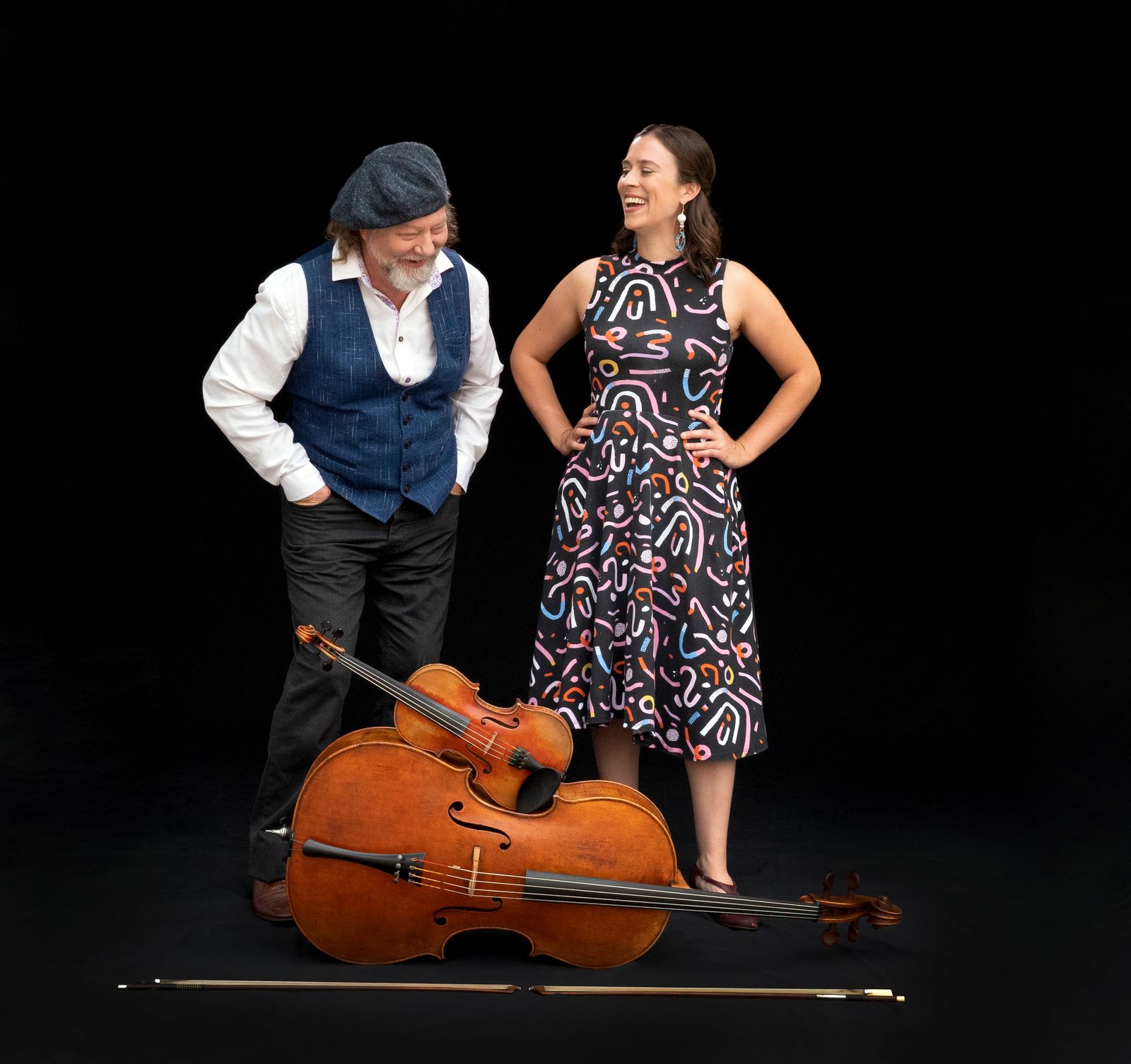 Photo of Alasdair Fraser & Natalie Haas in front of their musical insturments