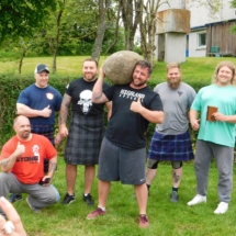 NHSCOT Trip to Scotland a picture of a group of Scottish people participating in the highland games